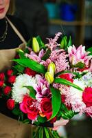 Woman Holding Bouquet of Flowers photo