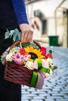 Person Holding Basket of Flowers photo