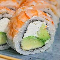 Close Up of Sushi Roll With Cucumbers photo