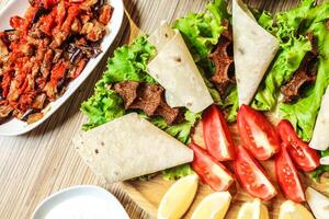 Abundant Spread on Wooden Cutting Board photo