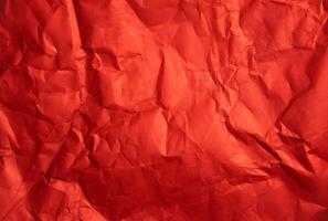 Crumpled red sheet of paper. Paper texture. Background for designers. Abstract background texture photo