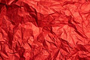 Crumpled red sheet of paper. Paper texture. Background for designers. Paper layout. photo