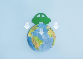 Green car, planet earth and symbol of hydrogen atom H2. Ecological transport. Reduction of carbon dioxide emissions. Ecology concept. photo