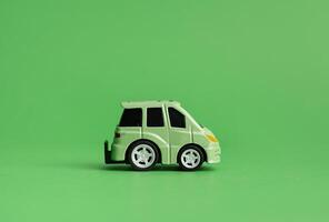 The concept of the environment. The concept of ecology. Green car on a green background. photo