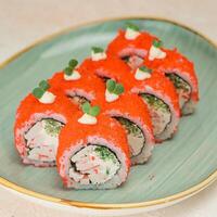 Sushi Plate With Red Sauce and Garnishes photo