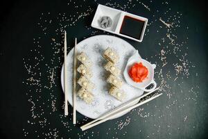 White Plate With Food and Chopsticks photo