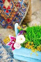 Blue Planter Filled With Grass and Flowers photo