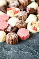 Assorted Types of Chocolates Arranged on a Table photo