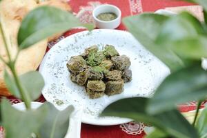 Plate of Food on Table With Red Tablecloth photo