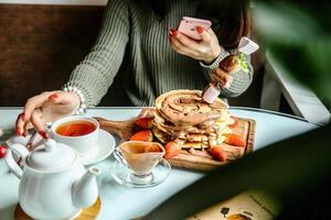 Woman Sitting at Table With Plate of Food photo