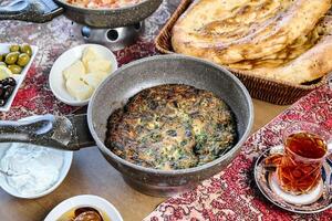 Table With Assorted Food Bowls and Bread photo