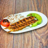 Delicious Plate of Food on a Rustic Wooden Table photo