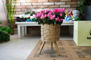 Basket of Flowers on Wooden Table photo