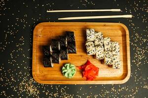 Wooden Tray With Sushi and Chopsticks photo