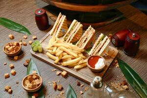 Wooden Cutting Board With a Halved Sandwich photo