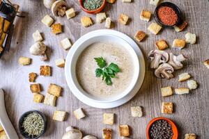 Wooden Table With a Bowl of Soup photo