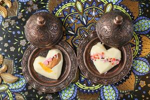 Two Heart Shaped Pastries on a Plate photo