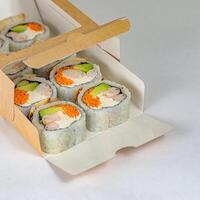 Sushi Box With Four Pieces of Sushi photo