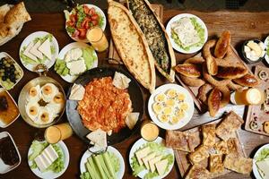 Abundant Wooden Table With Array of Delicious Food photo