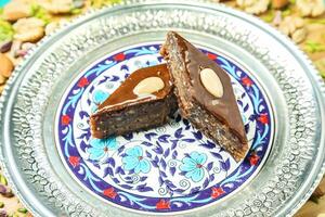 Two Pieces of Cake on a Plate on a Table photo