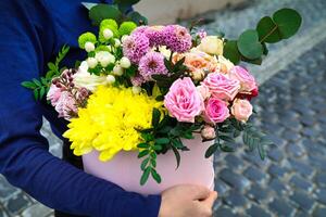 Person Holding Bouquet of Flowers in Hands photo