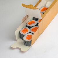 Cardboard Box With Sushi Rolls photo