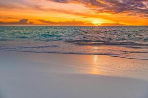 Closeup sea sand beach. Beautiful beach landscape. Inspire tropical beach seascape horizon. Dreamy sunset sky calm tranquil relax sunset summer mood. Positive energy, meditation summer tropical island photo