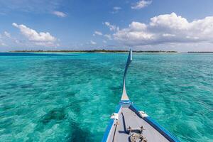 Amazing view over longtail boat travel vacation background. Beautiful sea tropical island and sky in Maldives islands. Exotic lagoon seascape atoll. Summer recreational adventure holiday cruise beach photo