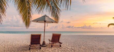 Tranquil sea sand sunset sky relaxing beach. Love couple romantic freedom travel tourism landscape. Idyllic exotic chairs umbrella, palm tree leaves, tropics beachfront resort. Summer vacation island photo