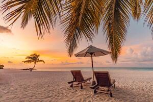 Tranquil sea sand sunset sky relaxing beach. Love couple romantic freedom travel tourism landscape. Idyllic exotic chairs umbrella, palm tree leaves, tropics beachfront resort. Summer vacation island photo