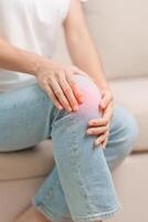 woman having knee ache and muscle pain due to Runners Knee or Patellofemoral Pain Syndrome, osteoarthritis, arthritis, rheumatism and Patellar Tendinitis. medical concept photo