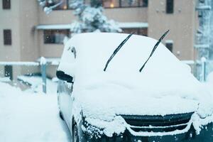 Car park at Ginzan Onsen with snow fall in winter season is most famous Japanese Hot Spring in Yamagata, Japan. photo