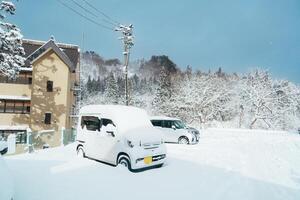 Car park at Ginzan Onsen with snow fall in winter season is most famous Japanese Hot Spring in Yamagata, Japan. photo