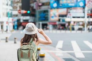 woman traveler visiting in Taiwan, Tourist sightseeing at rainbow crosswalk in ximending, Taipei City. landmark and popular attractions. Asia Travel, Trip and Vacation concept photo