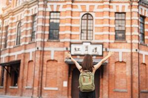 woman traveler visiting in Taiwan, Tourist sightseeing at Red House or old theater in Ximen, Taipei City. landmark and popular attractions. Asia Travel, Trip and Vacation concept photo