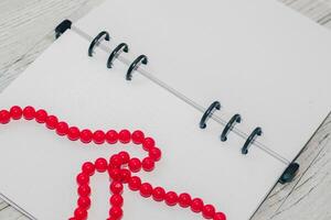 Notebook with rings, checkered sheets, transparent cover, beads, style concept photo