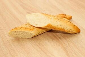 Fresh baguette made of white wheat flour with seeds and cereals photo