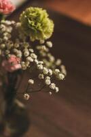 Wild flowers in a transparent vase in the interior. photo