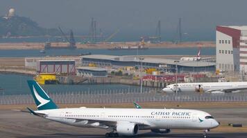 HONG KONG - NOVEMBER 10, 2019. Modern comfortable Airbus A350-941, B-LQA of Cathay Pacific taxiing on the runway at Chek Lap Kok Airport. Cathay Pacific Hong Kong airline video