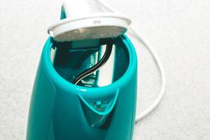 Close-up of an electric kettle that heats water, scum from water. photo