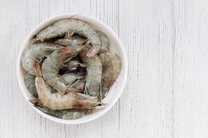 Raw large king prawns on a plate photo