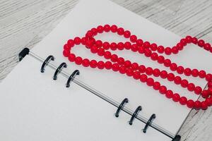 Notebook with rings, checkered sheets, transparent cover, beads, style concept photo