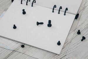 Notebook with rings, checkered sheets, transparent cover with chess. photo