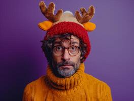 AI generated A man wearing a reindeer hat and glasses stands on a purple background, funny costumes and disguises picture photo