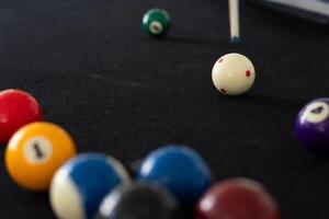 Close up View of Man Playing Pool Table photo