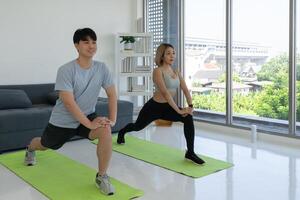 Young Asian Couple Workout  at Home Together photo