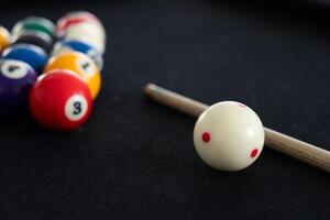 Close up View of Man Playing Pool Table photo