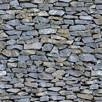 Old wall stone texture and background with rustic tiles design photo