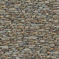 Old wall stone texture and background with rustic tiles design photo