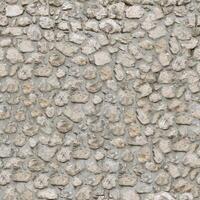 Old wall stone texture and background with rustic tiles design photo